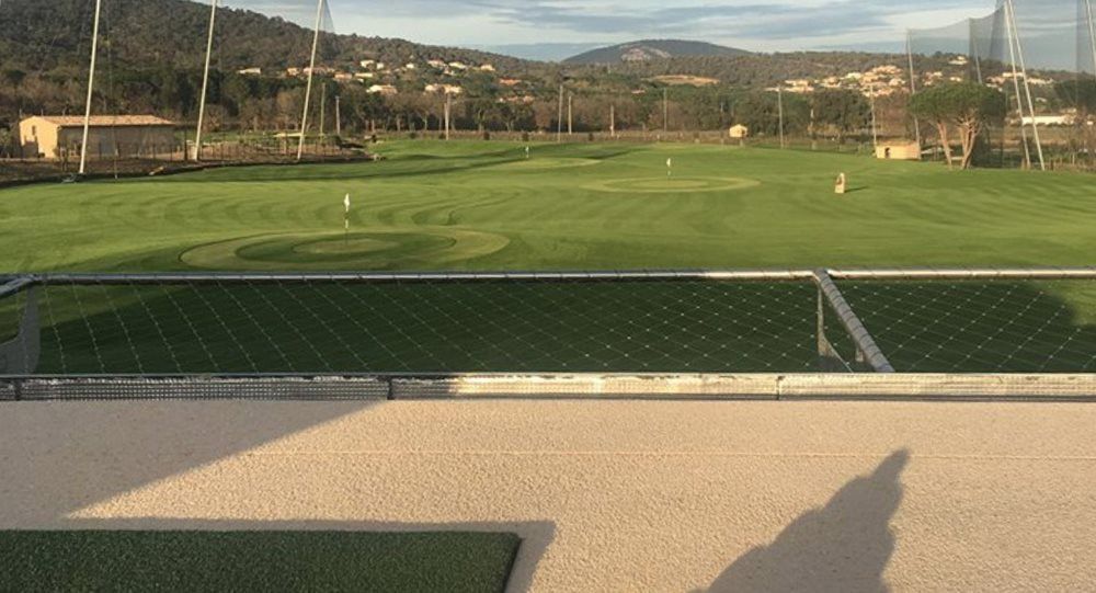 Huntsville Synthetic turf beside natural grass golf course